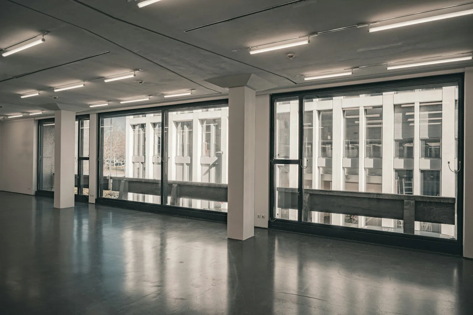 A modern office interior with large windows and natural light