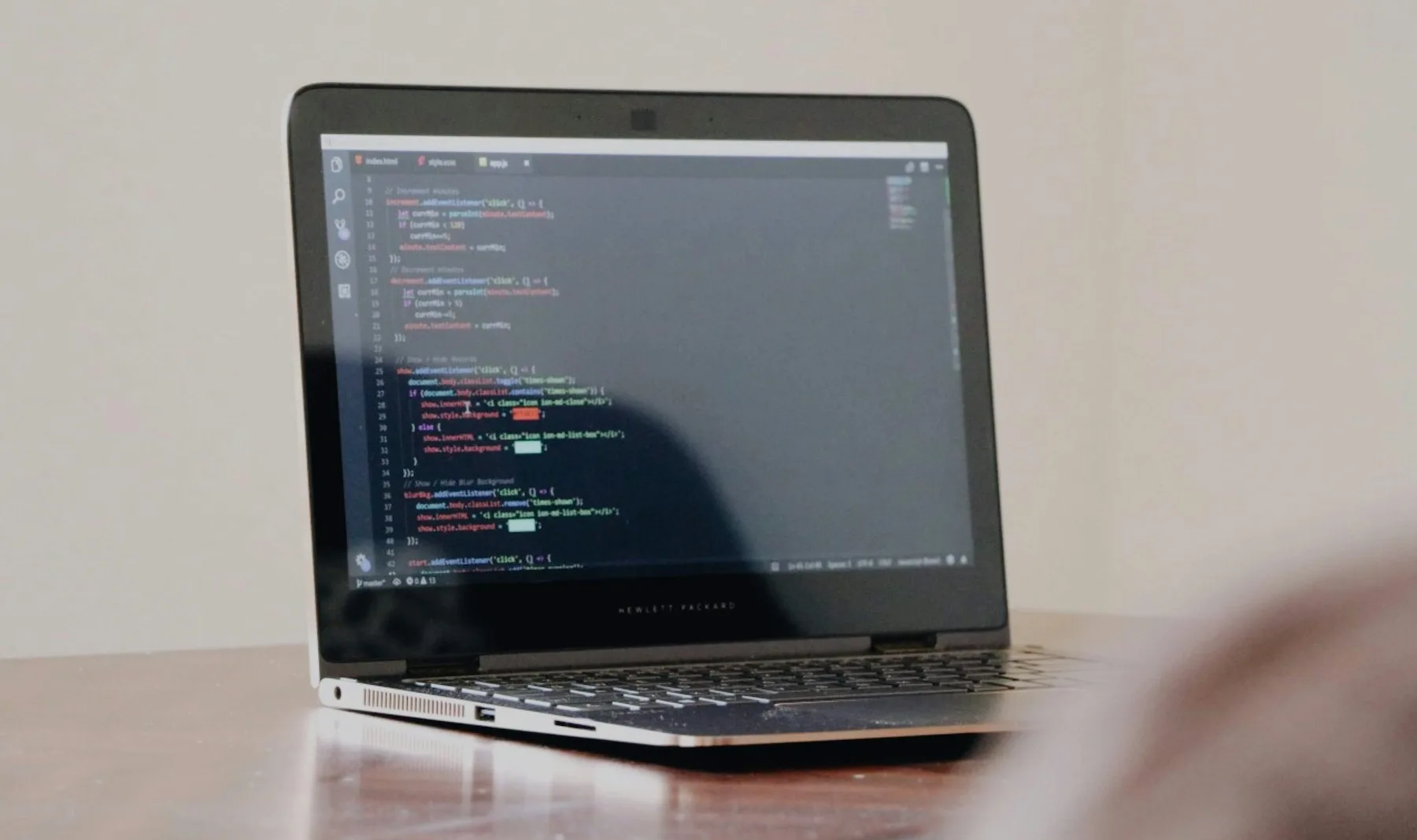 A laptop displaying application source code
