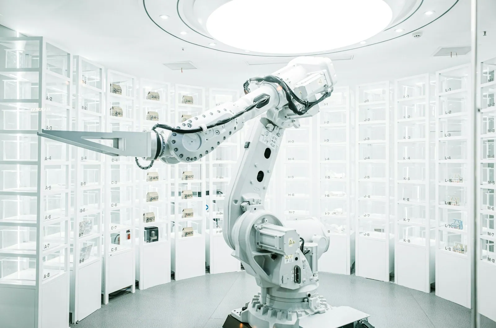 Industrial robotic arm inside an automation cell